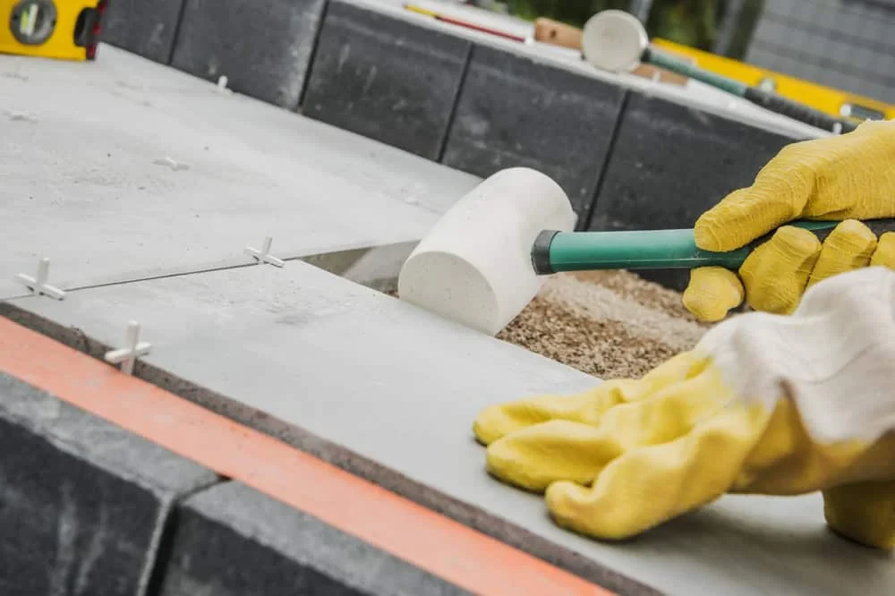 Landscaper Adjusting Stone Tiles Mecklenburg County North Carolina