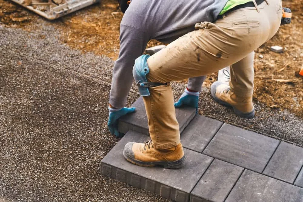 Landscaper Laying Gray Pavers Mecklenburg County North Carolina